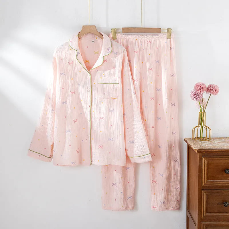 Women's beige cotton pajama suit with long sleeves and trousers for homewear.