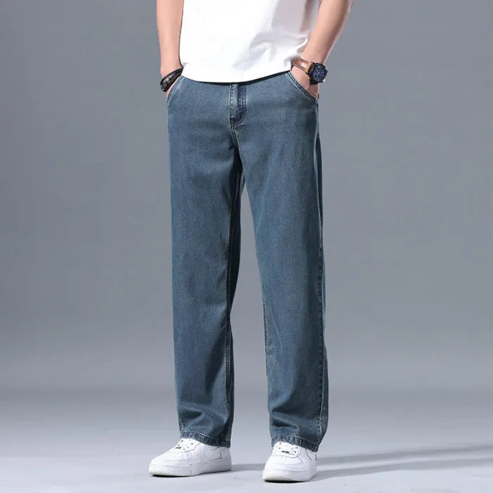 Men's loose fit straight-leg lyocell jeans in light blue colour with a zip fly.