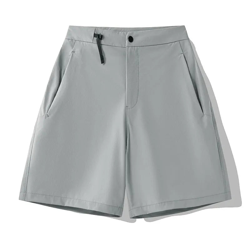 Men's khaki quick-drying sports shorts with 3D elastic cutting on a grey background.