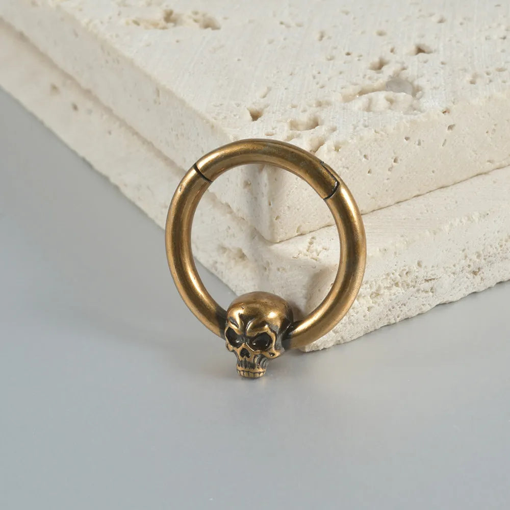 Copper ghost head punk earrings in antique silver and gold colours