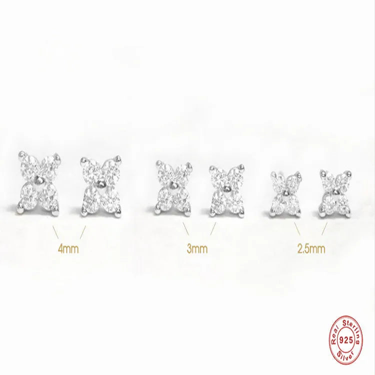 S925 sterling silver stud earrings with small crystal flower petals in gold and platinum finishes.
