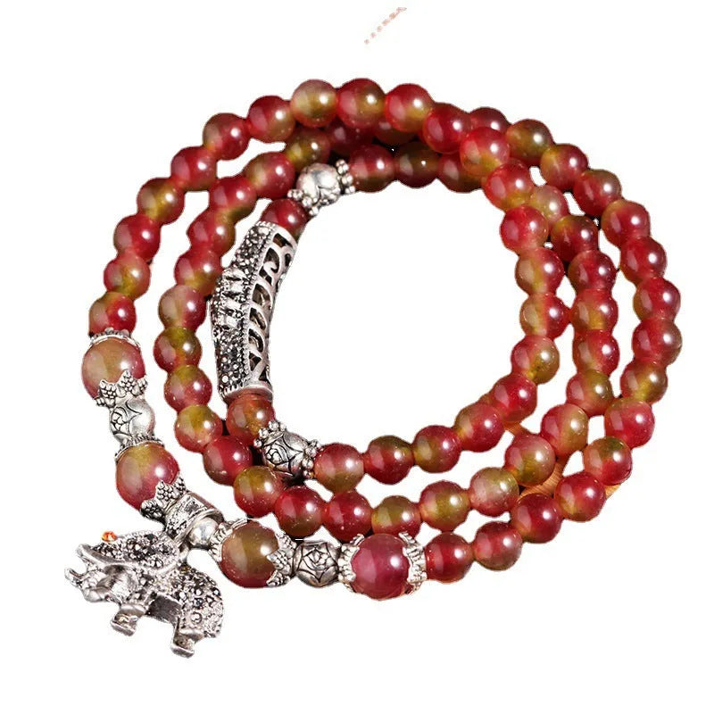 Handcrafted natural watermelon crystal bracelet with geometric beads and Chinese knot adjustable closure