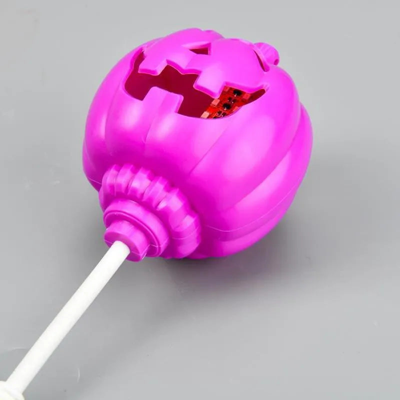 Plastic pumpkin lamp with USB charging cable in yellow or purple light colour