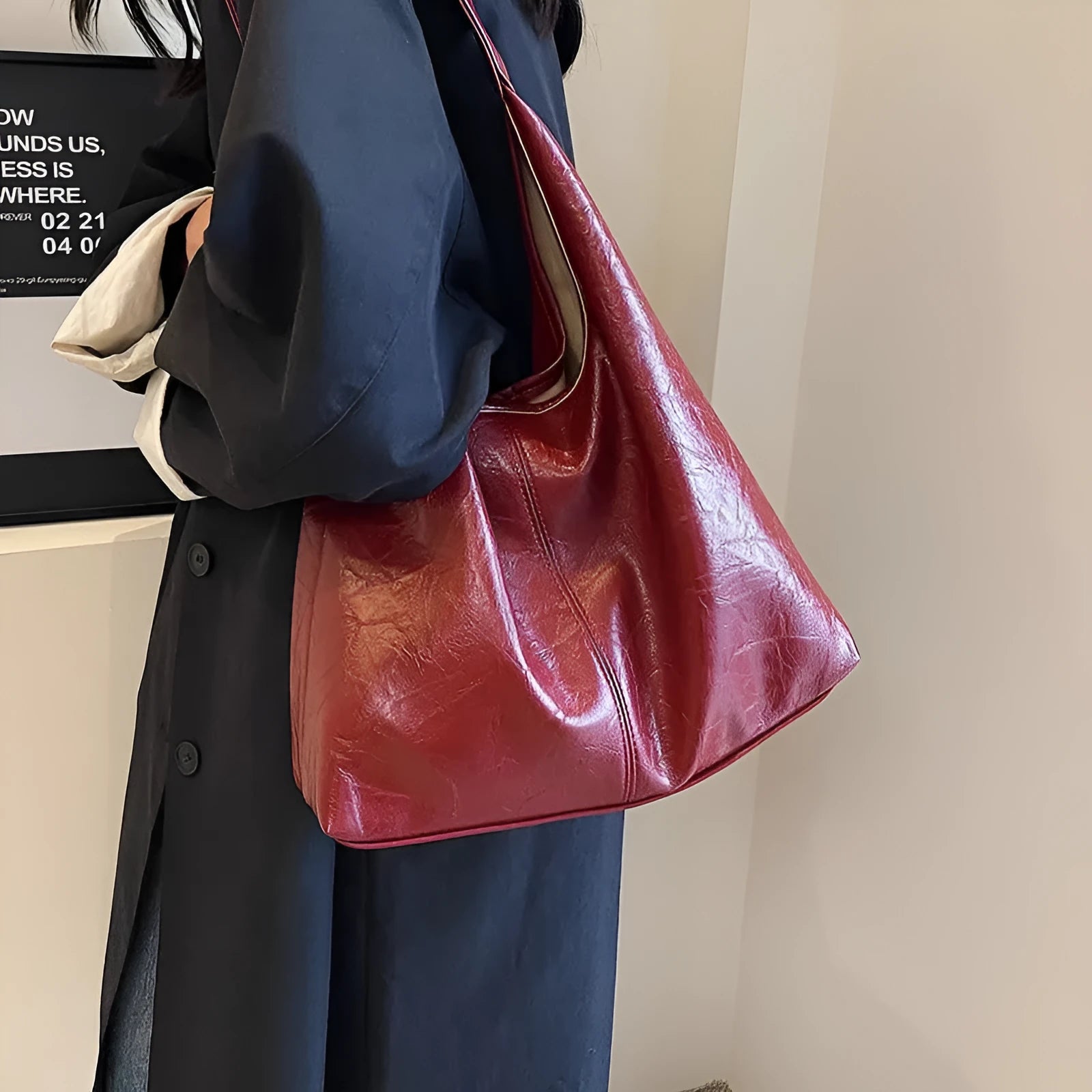 Casual soft PU leather large capacity shoulder bag in street trend style.