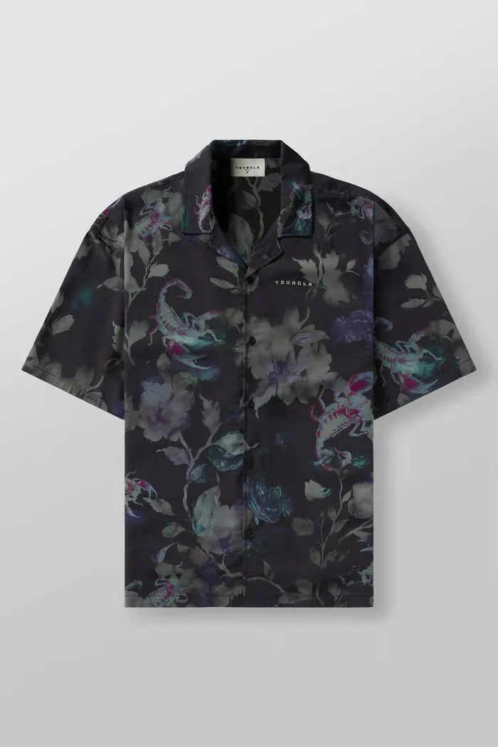 Man wearing a loose grey short sleeve cardigan top with a white floral print pattern.