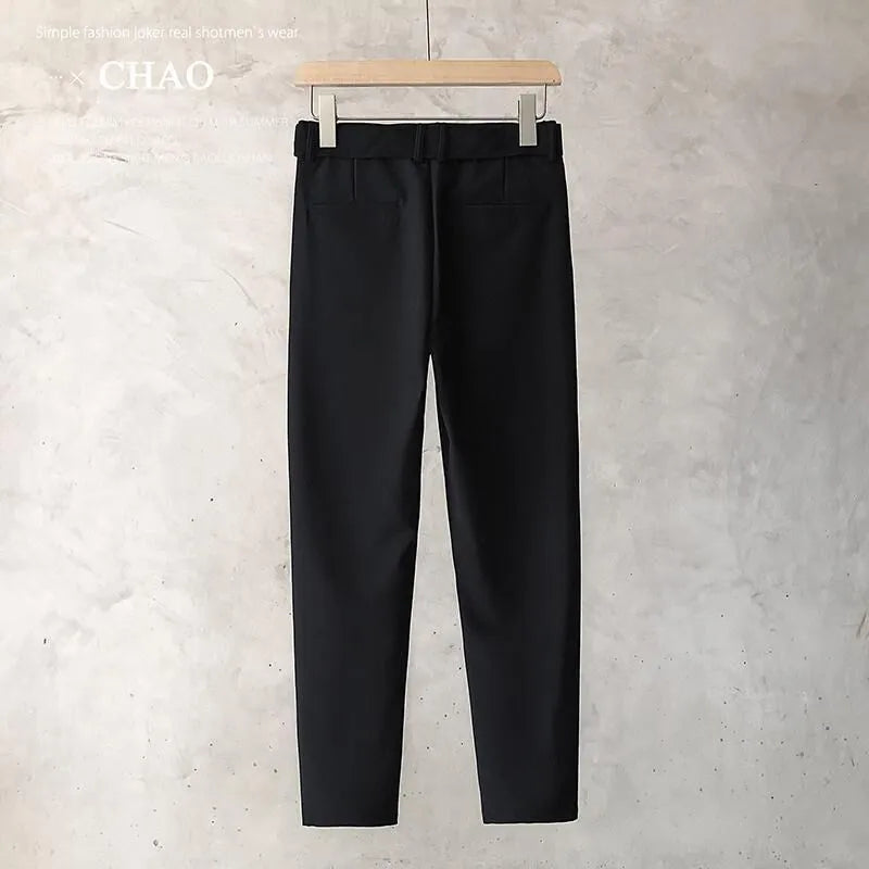 Boys slim straight tapered wool trousers in light grey on a hanger, showing the straight leg opening and business casual style.