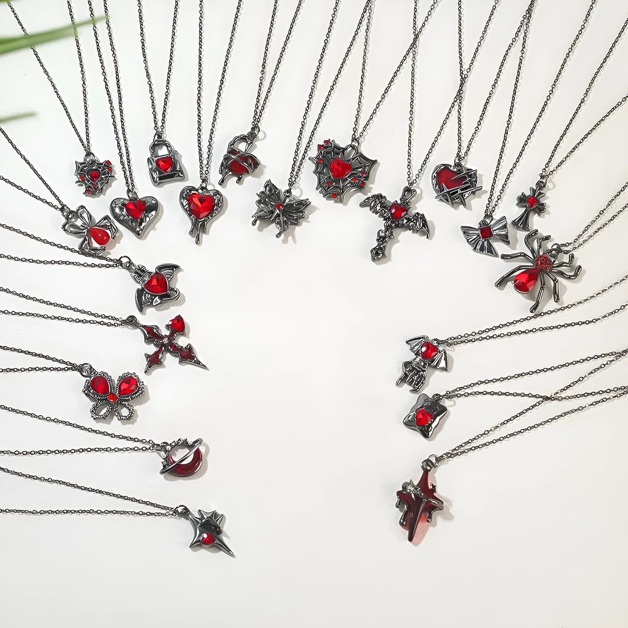 Dark Halloween necklace with zinc alloy electroplated pendant showing spider web and bat designs on regular chain