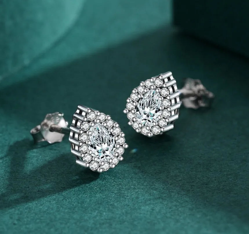 Silver water drop shaped ear studs with diamond treatment surface texture