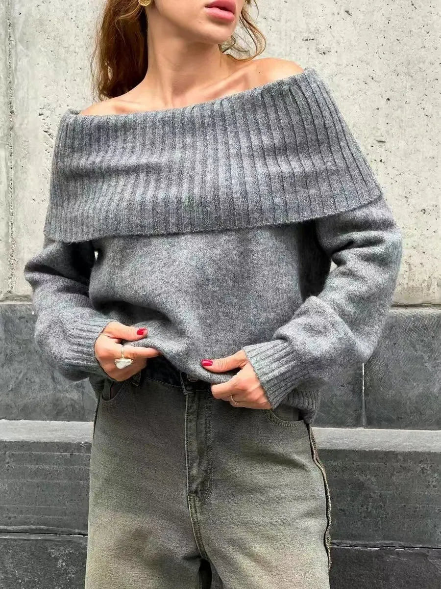 Grey off-the-shoulder sweater with a 3D pattern texture, showing strapless neckline design.