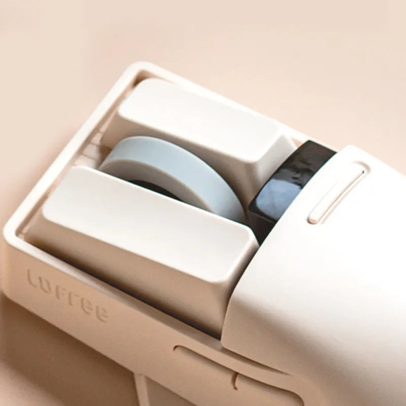 Xiaoqiao Tofu Colour wireless computer mouse with USB receiver on a desk.
