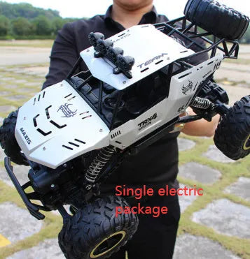 Black and silver remote control climbing cars with 2.4G wireless controller on a rough surface.