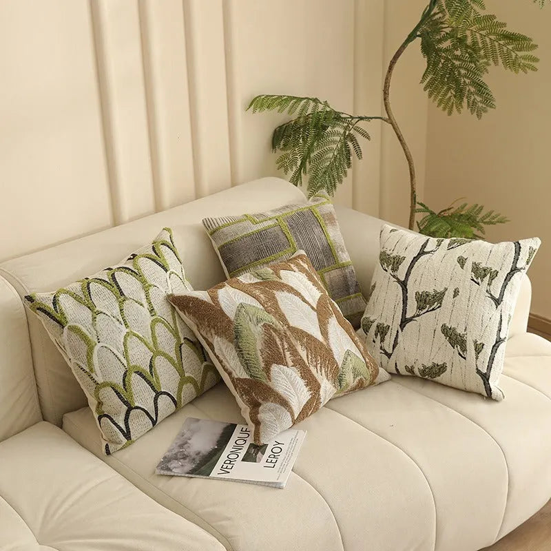 Jacquard floral pattern cushion cover in a retro colour, 45cm square, on a sofa.
