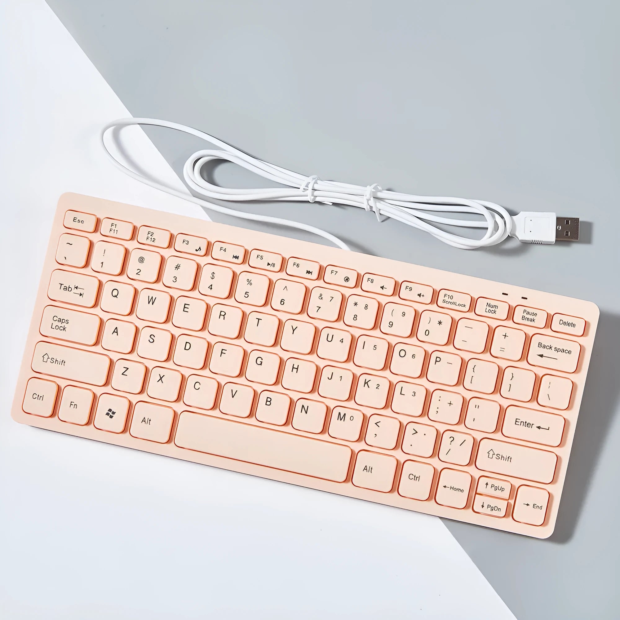 Mini wired USB computer keyboard in black, white, pink, or blue colour options.