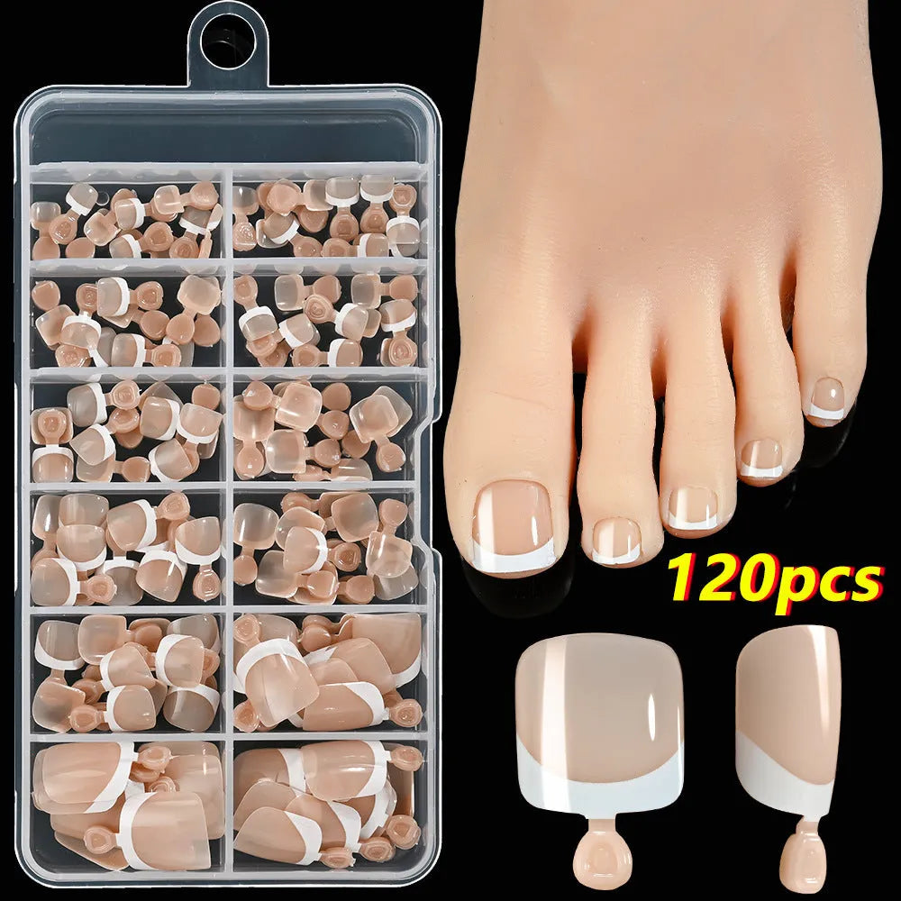 Box of 120 French white edge press-on toe nails in full square short shape showing multiple nude shades.