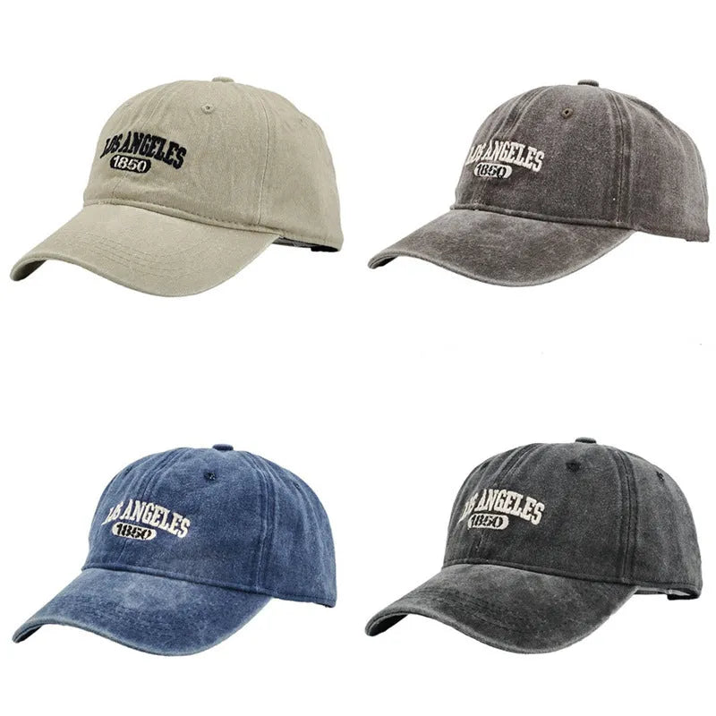 Retro washed distressed embroidered peaked cap with adjustable strap on a conical crown.