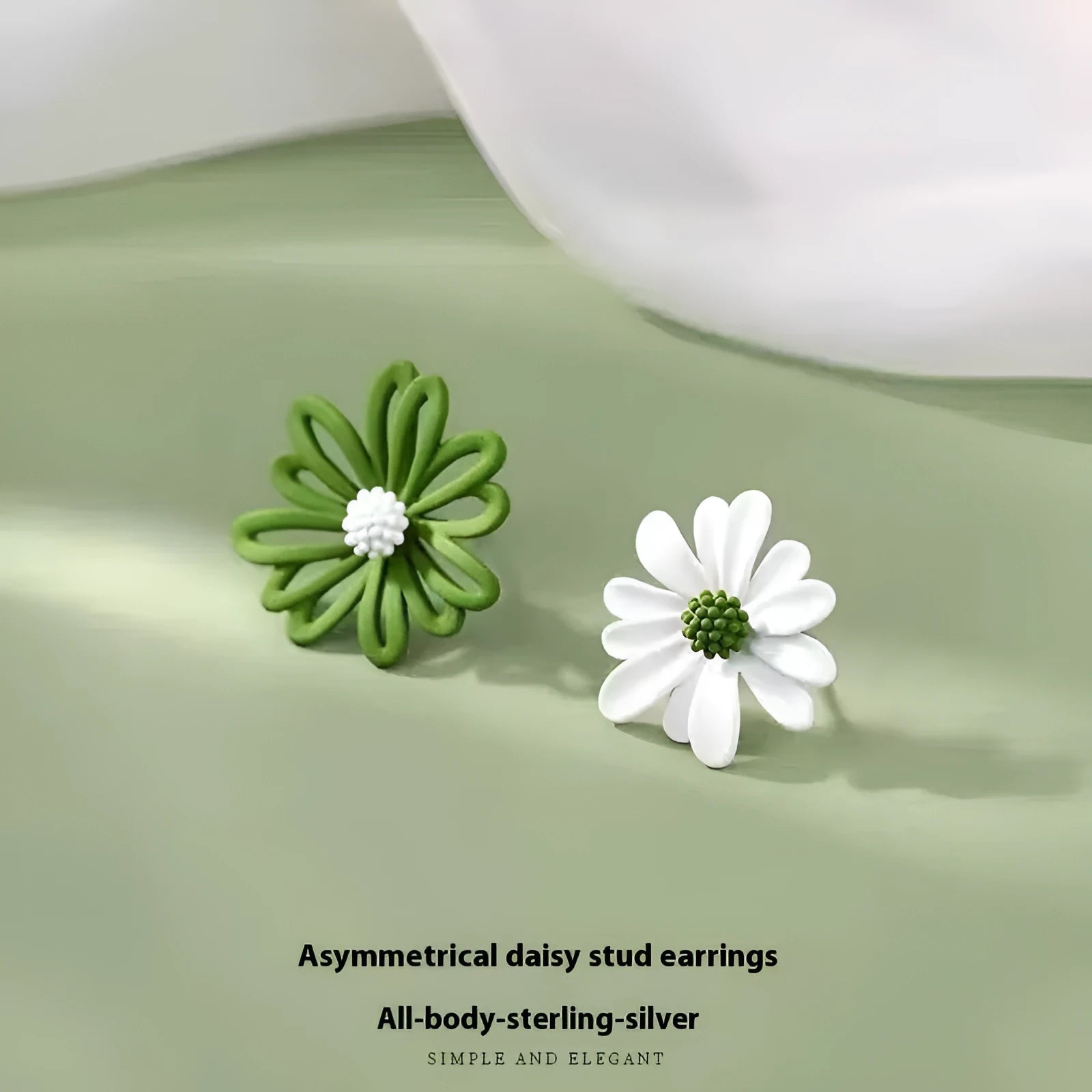 A pair of cartoon-style flower stud earrings in alloy, showing a blue and orange two-tone colour variant.