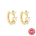 Sterling silver geometric stud earrings with small round design elements in gold or silver finish