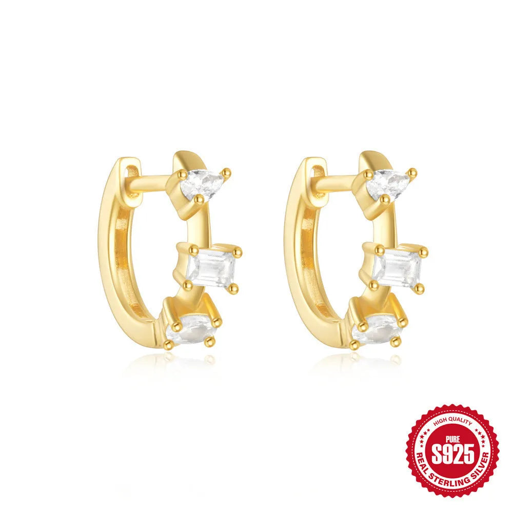 Sterling silver geometric stud earrings with small round design elements in gold or silver finish