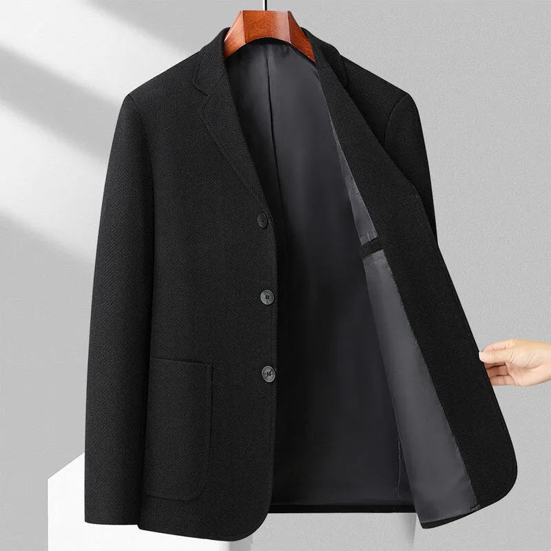 Men's loose fit woolen coat in a solid colour, shown on a model for casual spring or autumn wear.