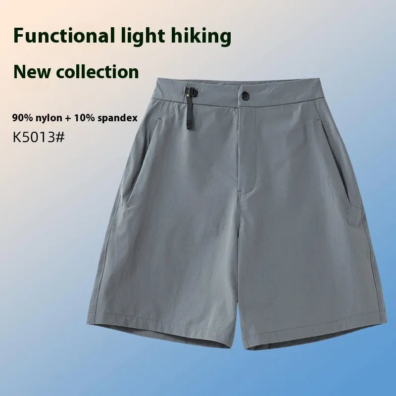 Men's khaki quick-drying sports shorts with 3D elastic cutting on a grey background.