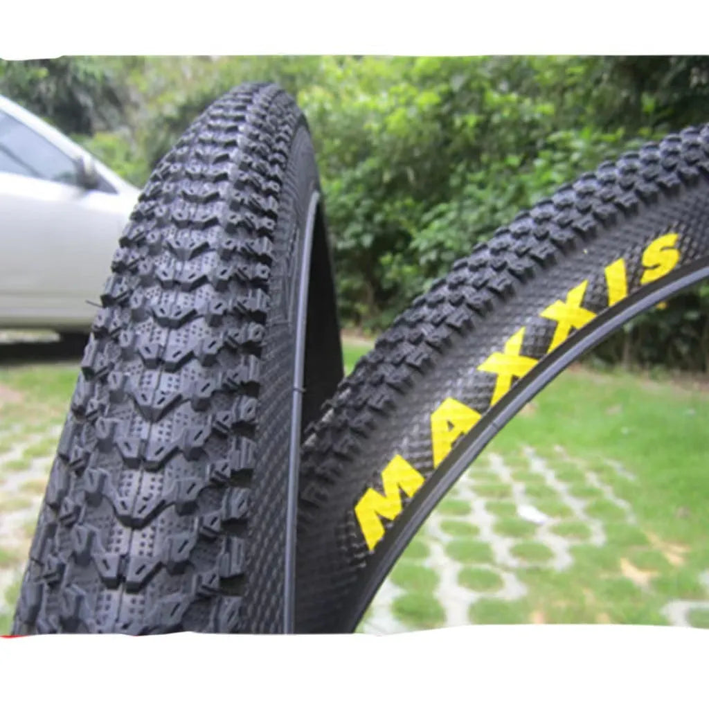 Mountain bike tyre with puncture-proof construction, shown in multiple sizes including 26x1.95 and 27.5x2.1