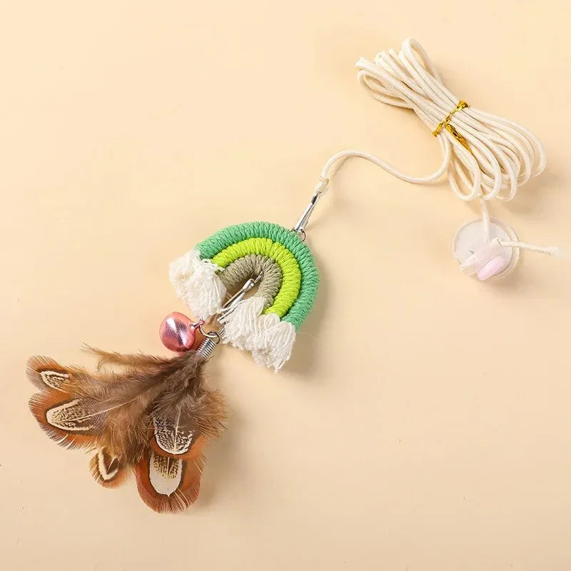Colourful feather cat rope toy hanging from a door with elastic swing and sticky buckle clamp