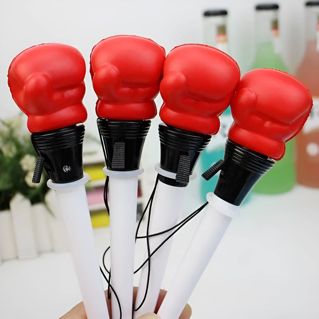 Four Creative Pressure Relief Boxing Press Ejection Pens with plug-in sleeves and black ink refills.