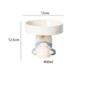 Raised ceramic cat food bowl in animal design, showing elevated height and wide bowl.