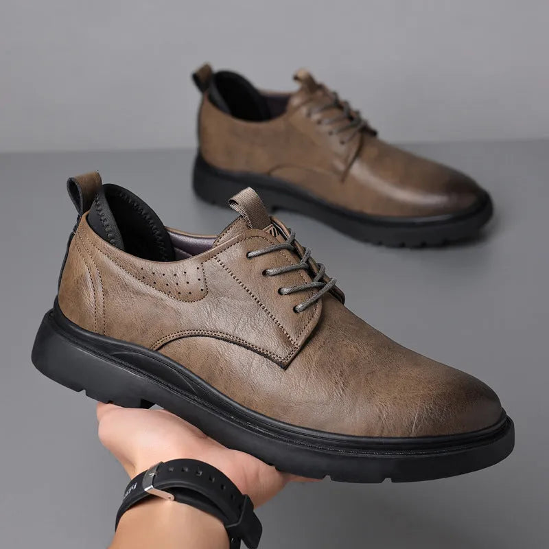 Men's black and brown leather casual sneakers with rubber soles and sewn detailing