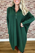 Women's solid colour loose knitted dress with raglan sleeves, shown in dark green.
