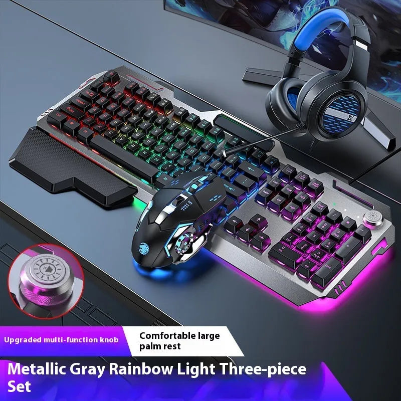 Aluminium gaming keyboard with volume knob, shown in metal grey with RGB lighting alongside optional macro mouse and headset.