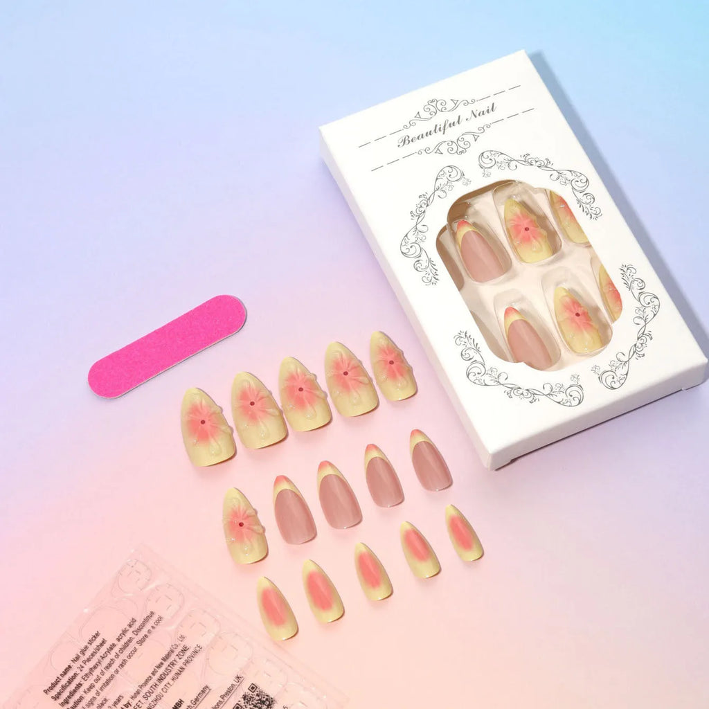 Set of plastic detachable fake nails with pink and white 3D cartoon flower designs, pot of jelly glue, and a nail file.