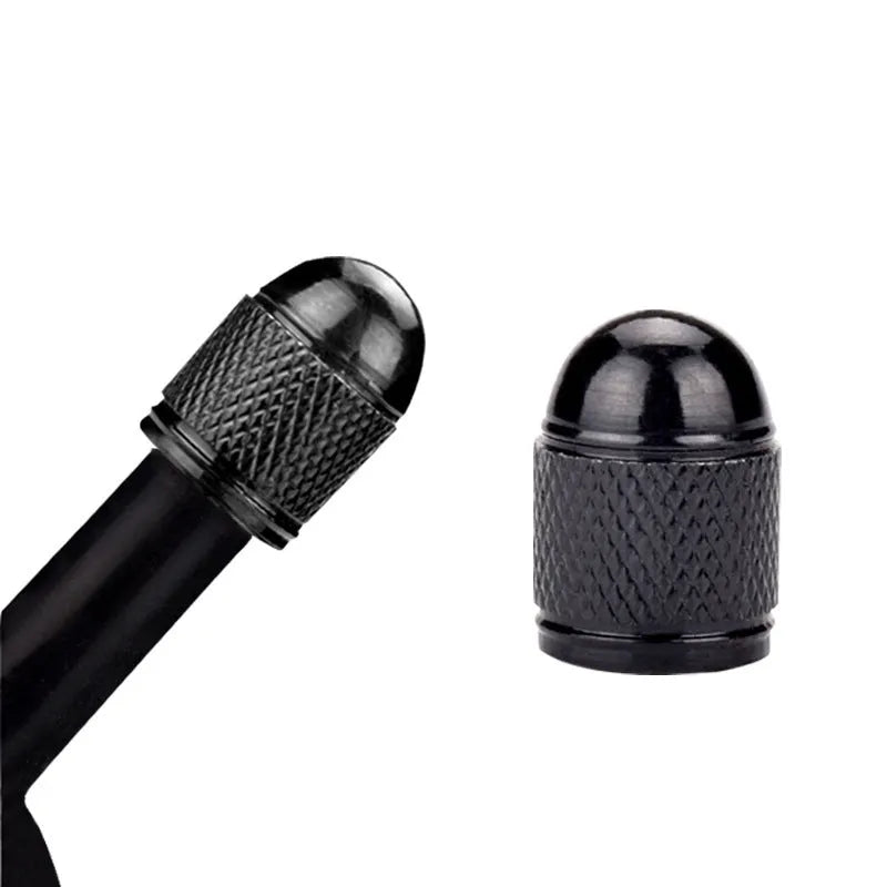Aluminium alloy mountain bike tyre valve cap in multiple colour choices on a bicycle wheel.