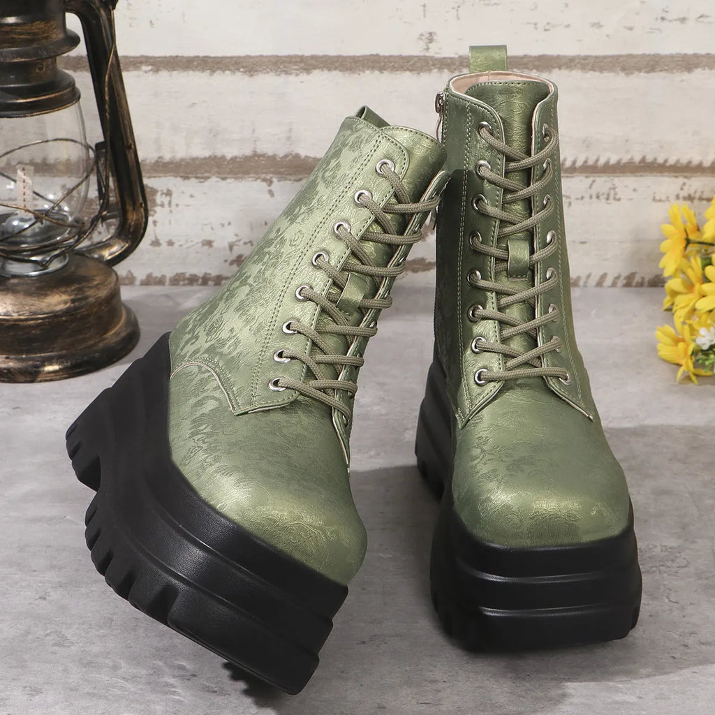 Women's black retro platform Martin boots with patchwork toe and side zip.