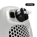 White ceramic heating electric hot air blower heater with remote control on wooden surface