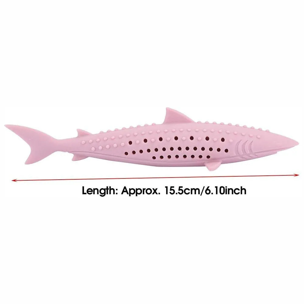 Green silicone fish shaped cat chew toy with breathable side holes on a white background