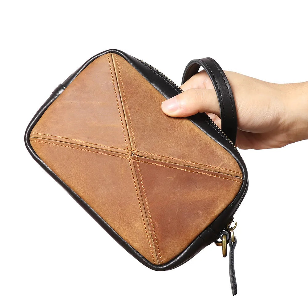 Unisex retro brown genuine leather messenger bag with artistic stitching and horizontal square shape on a plain background