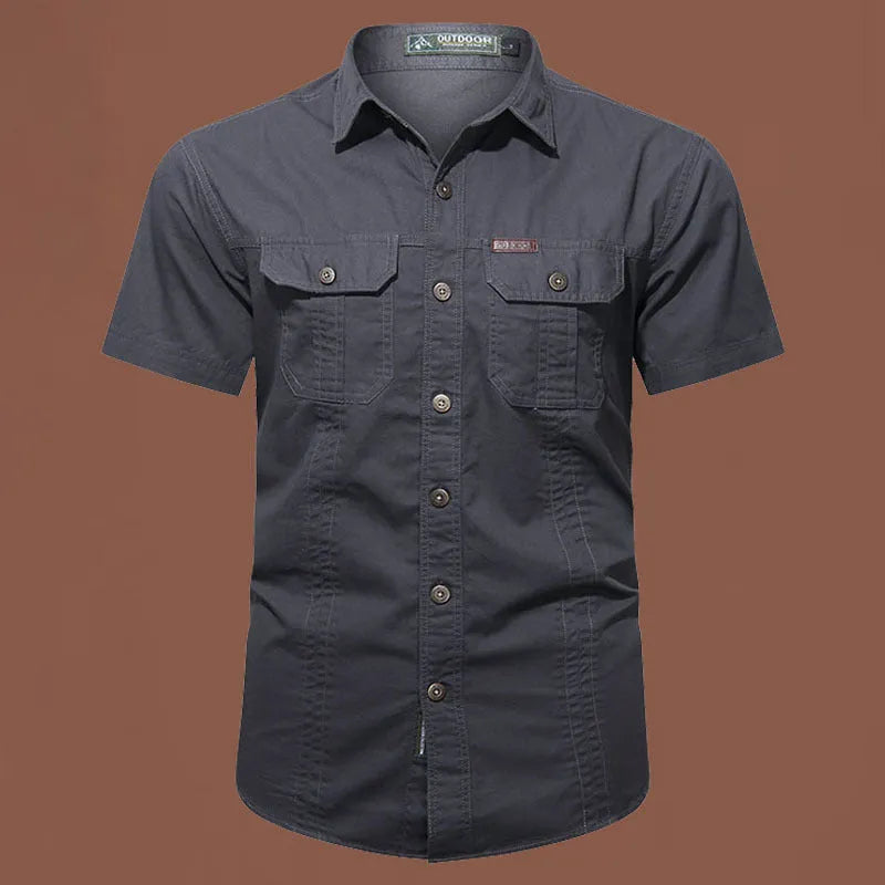 Men's loose-fitting short sleeve cotton work shirt in army green, laid flat.