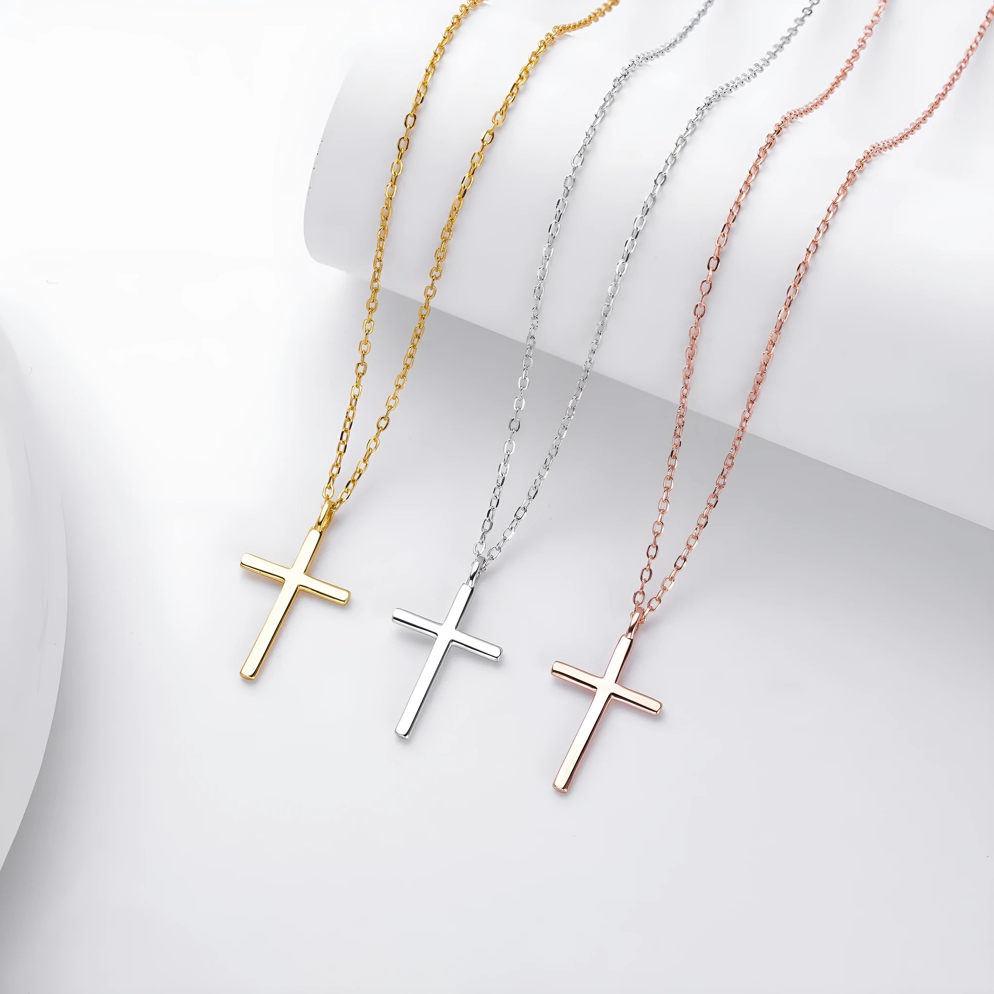 S925 sterling silver necklace showing simple glossy cross pendant on O-shaped chain in gold plating
