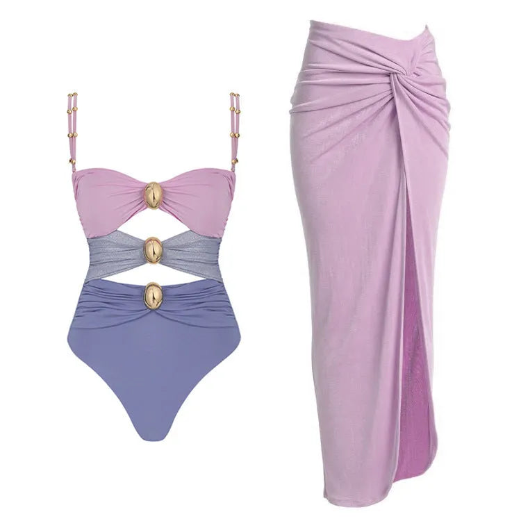 Women's solid colour one-piece swimsuit with gold buttons and matching skirt