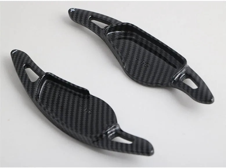 Carbon fibre steering wheel shift paddle in ABS plastic showing five colour finish options