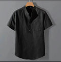 Men's beige loose-fit linen short sleeve shirt with a stand collar on a hanger.