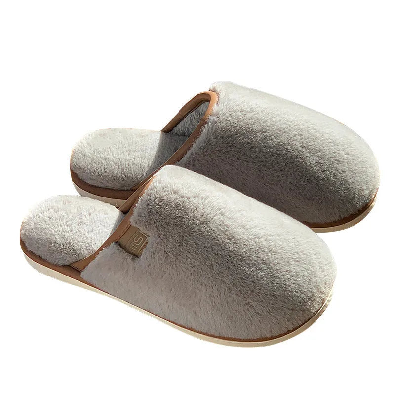 Solid colour PVC winter plush house slippers with car stitching detail on a non-slip sole.
