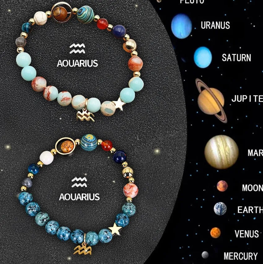 Set of two natural stone beaded bracelets for twelve zodiac signs on a wooden surface.