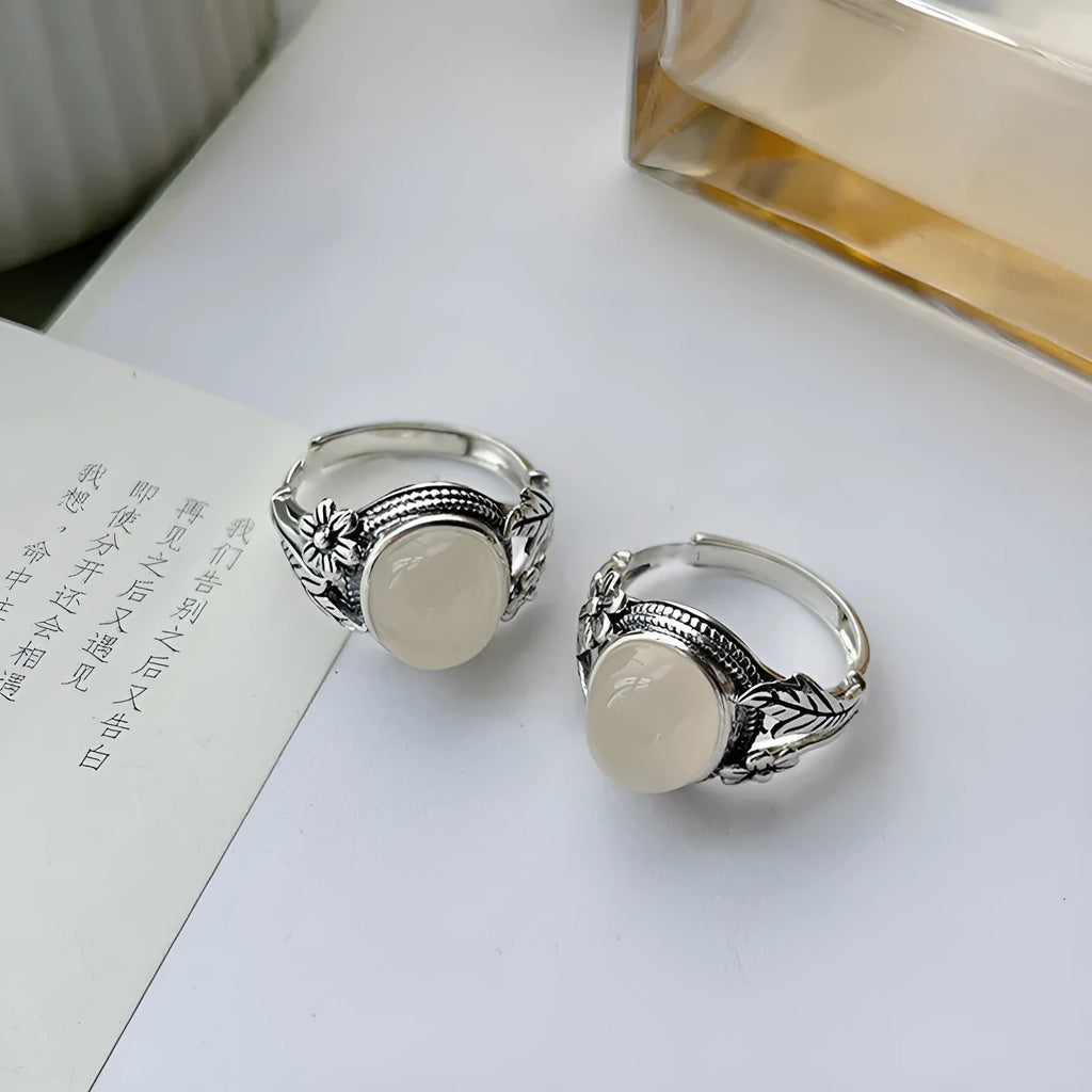 Adjustable vintage-style copper ring with white chalcedony finish showing open mouth design