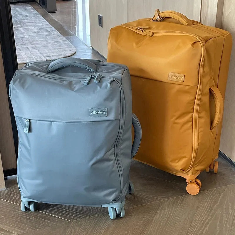 Ultra-light waterproof Oxford cloth suitcase with universal wheels in bluestone green colour.