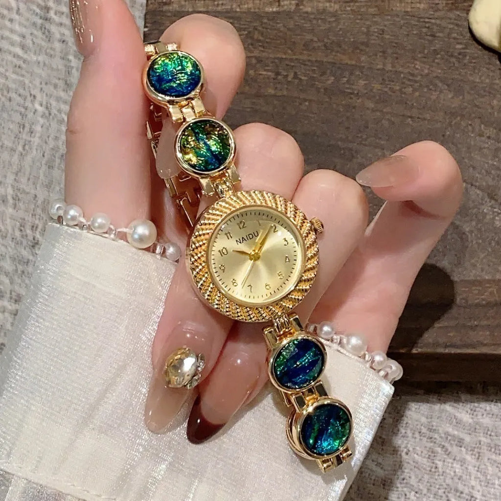 Women's quartz watch with 25mm round dial in choice of six colours on wrist.
