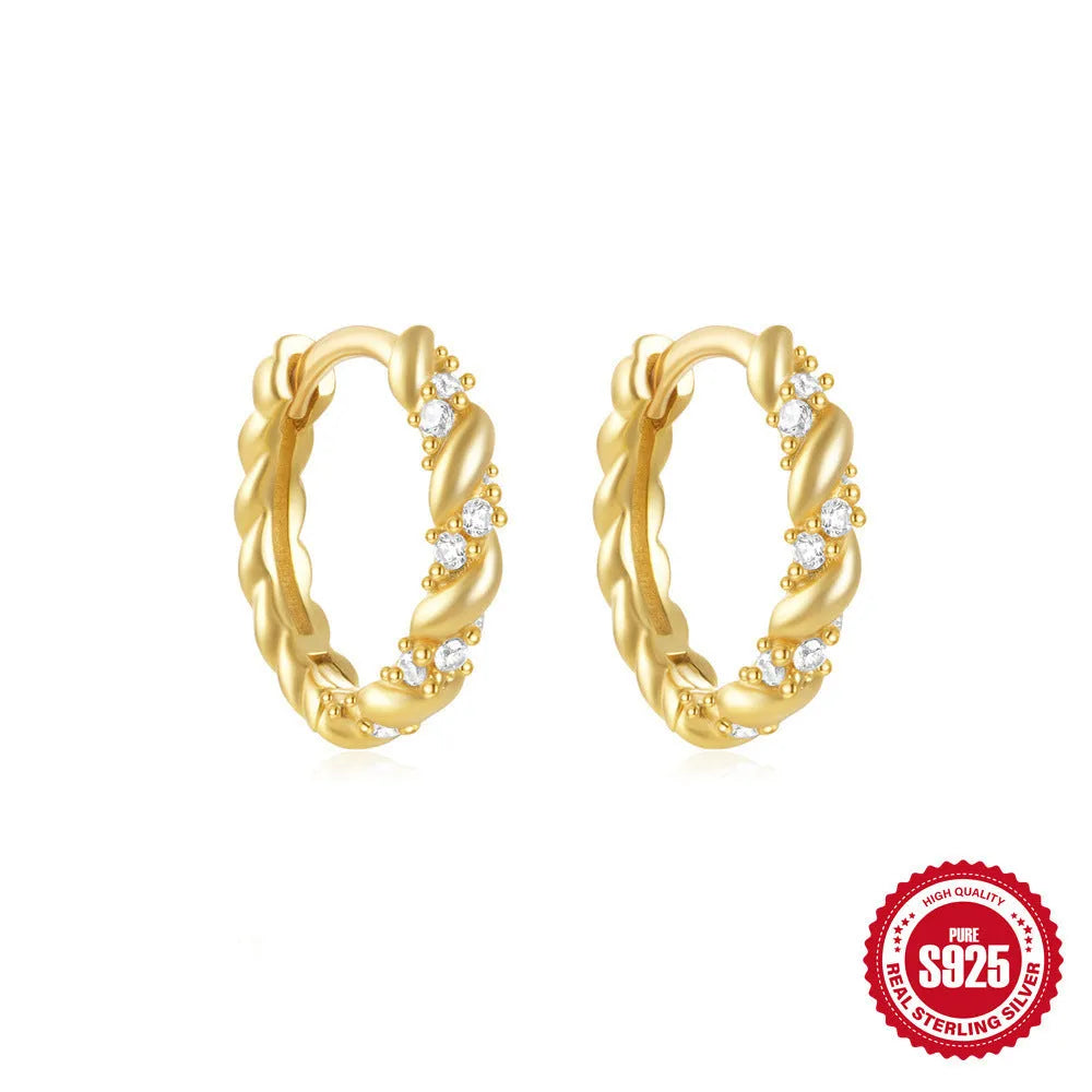 Sterling silver geometric stud earrings with small round design elements in gold or silver finish