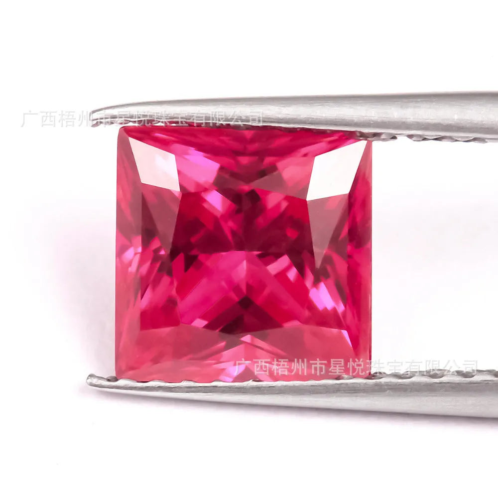 Cultivated pigeon blood red ruby gemstone in round cut on a white background.
