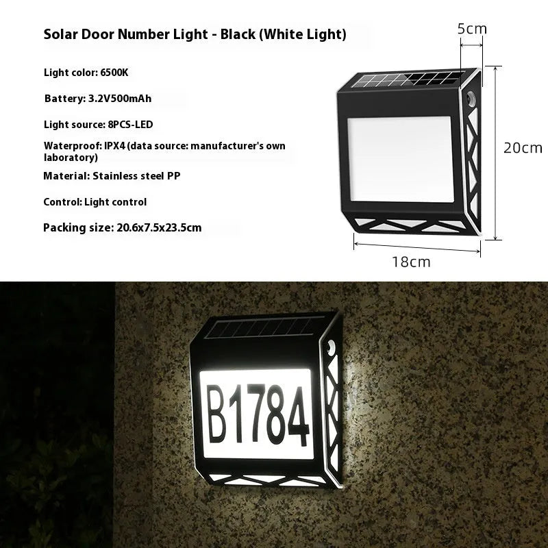 Black solar-powered doorplate light with LED illumination for house numbers measuring 180x50x200mm